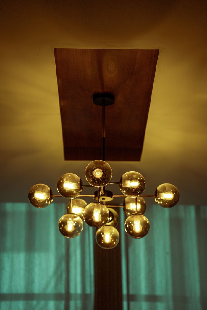 Elegant modern chandelier with warm lighting creating an inviting atmosphere indoors.